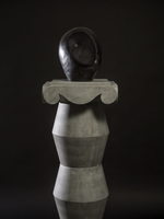 Abstract sculpture with geometric design on a black background